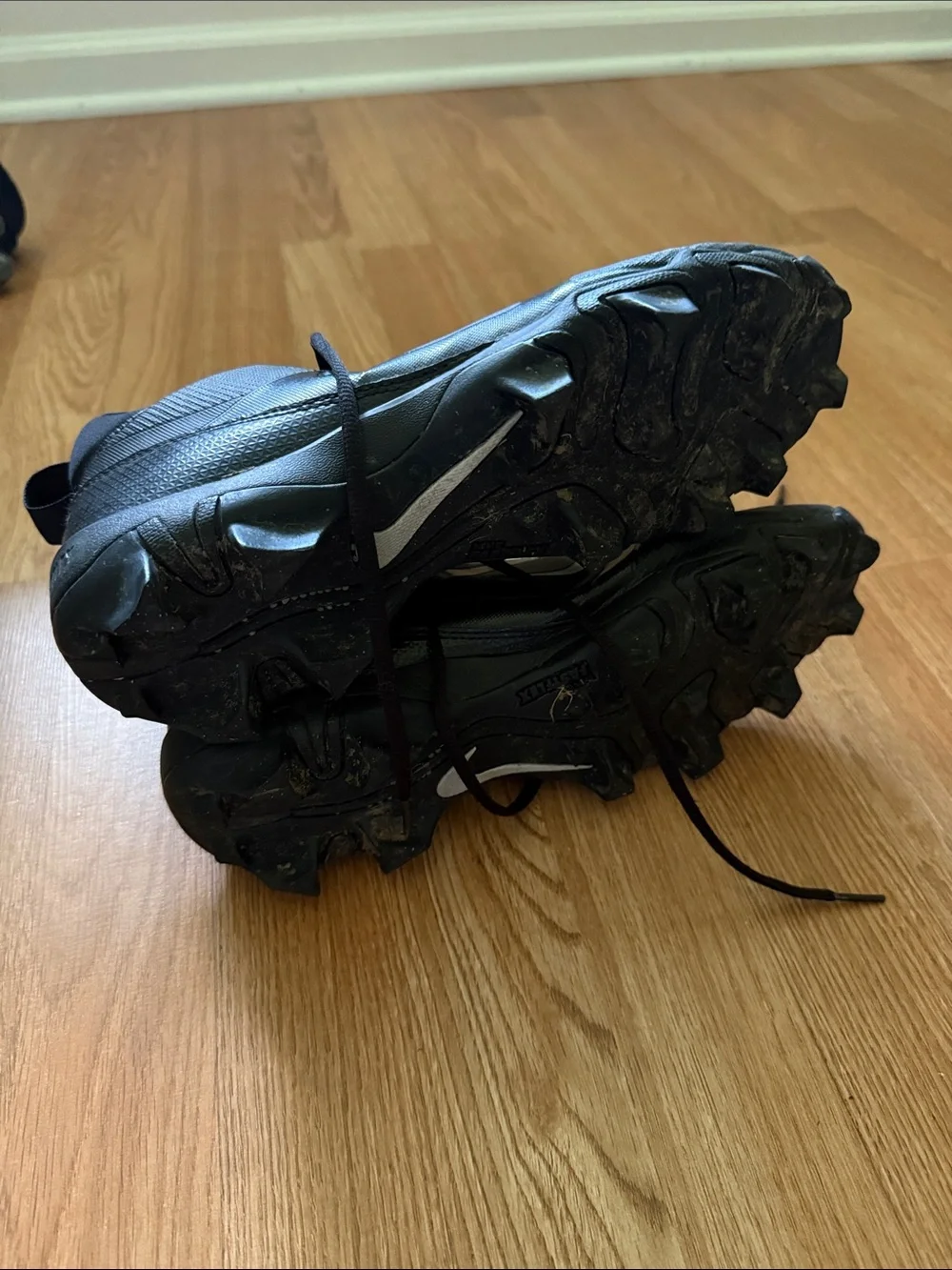 Nike Black Men's Athletic Cleats with White Swoosh